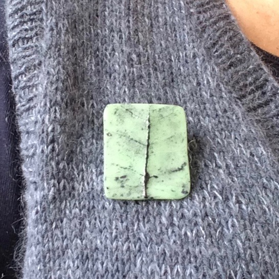 Mint green brooch on knittet west